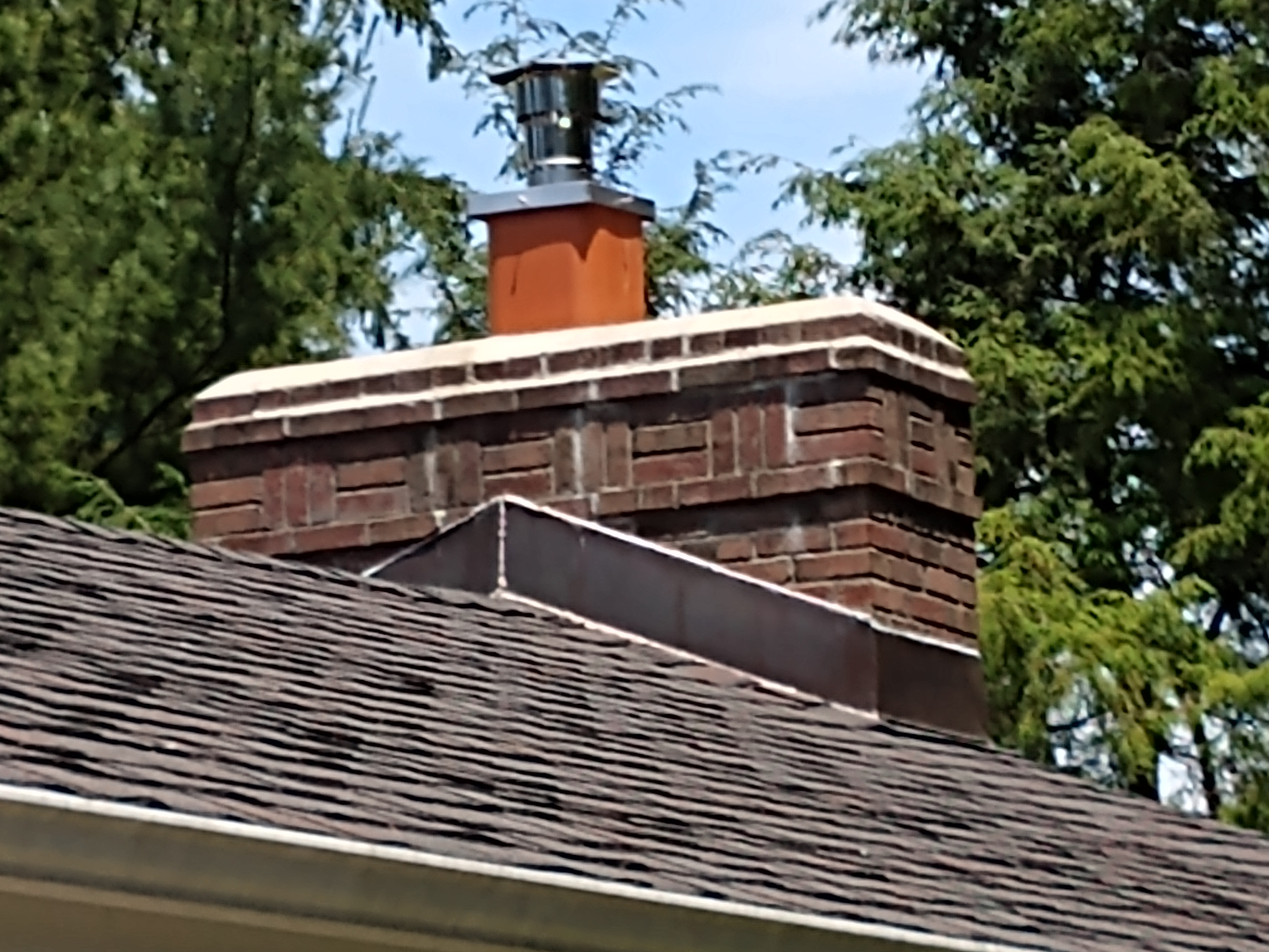 Stainless steel chimney cap with animal guard in Massapequa Park, New York